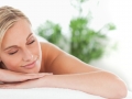 Close up of a woman lying on a lounger having a massage